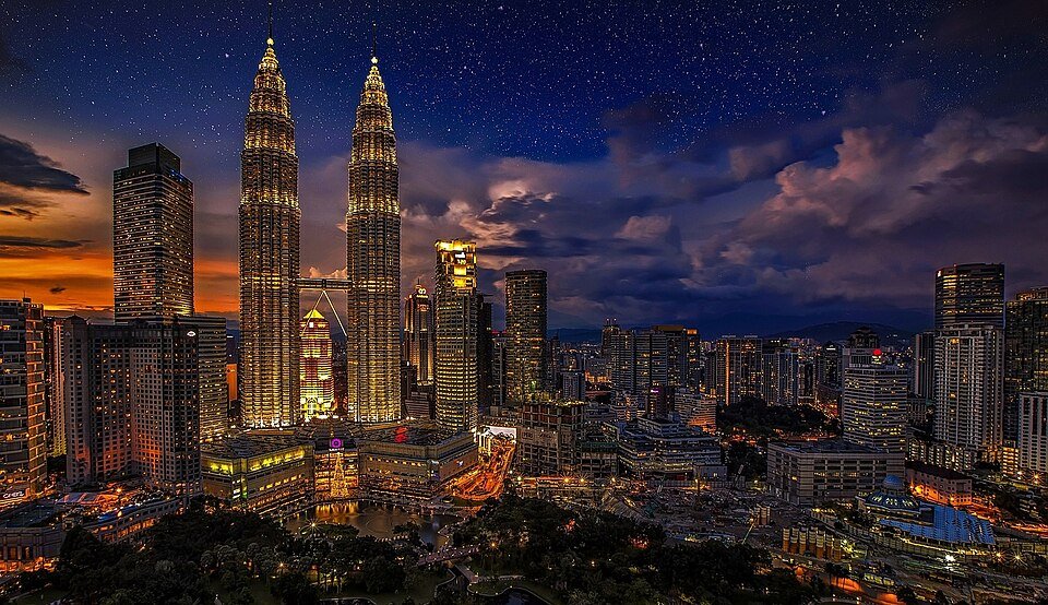 Kuala Lumpur skyline at dusk with the Petronas Twin Towers