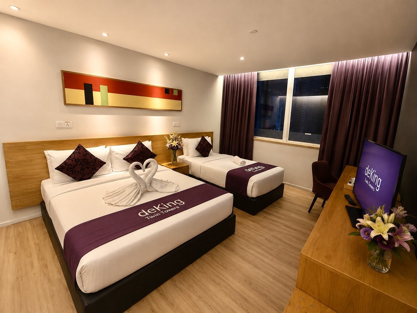 Deluxe Triple City View room at deKing Hotel KLCC with one twin bed and one king bed